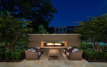 Courtyard with fireplace at Everra Midtown Park Apartments in Dallas, TX